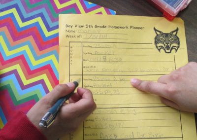 CLV mentor helps student with 5th grade homework planner